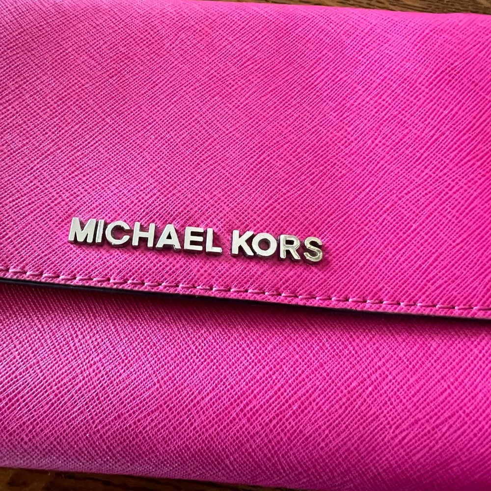 Micheal Kors pink crossbody small wallet purse.